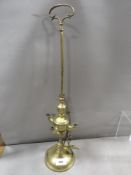 An antique brass Lucerne standing lamp