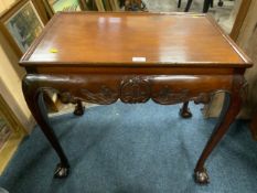 An antique mahogany small silver table in the Irish style, raised on cabriole supports with ball and