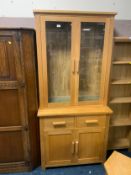 A modern light oak glazed bookcase W 92 cm
