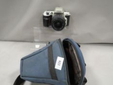 A Nikon F60 camera with bag