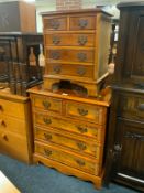 A small yew wood four drawer chest W 63 cm together with a miniature similar chest W 42 cm. (2)