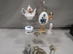A small tray of collectables to include silver sugar tongs, silver handled shoe horn, early salts,