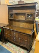 A glazed reproduction dresser