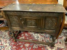 An antique carved oak cabinet with single door W 92 cm
