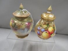 A Royal Worcester pierced lidded vase decorated with fruit signed bottom right together with a