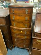 A small reproduction walnut crossbanded chest on chest H 116 cm W 45 cm