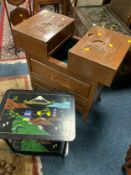 An Eastern style sewing box on castors together with a small lacquered table. (2)