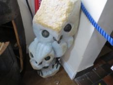 A stone type statue of two owls, H 90 cm, W 35 cm