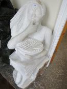 A white quartz type statue of a lady eating fruit, H 96 cm, W 40 cm