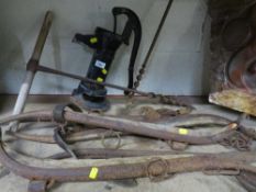 A selection of vintage horse hames and drill augers together with a water pump