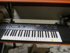 A Technics K350 keyboard, stand and charger
