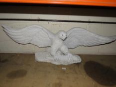 A white quartz stone type statue of a landing eagle A/F - W 120 cm, H 40 cm