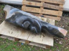 A large marble / stone type statue of a tribal head, signed 'ISSA SIM'- H 190 cm, W 70 cm