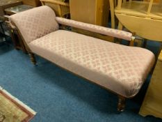 An Edwardian oak chaise longue
