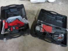 A cased Champion circular saw and a cased angle grinder