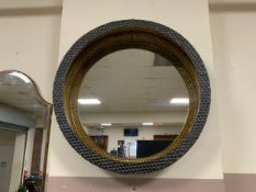A modern circular metal wall mirror Dia. 50 cm