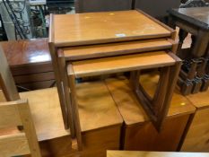 A mid century G-Plan nest of three teak tables S/D
