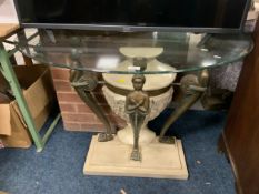 A glass topped half moon console table with resin figurative base H 70 cm W 98 cm