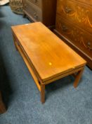 A mid-century teak two tier table L 91.5 cm