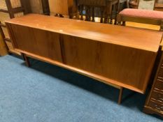 A mid century teak sideboard with sliding tambour doors W 211 cm
