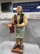 A POS resin style tall figure of a waiter