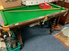 A small slate bed snooker table on a barleytwist separate base, with a cue and accessories 72 x