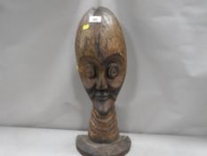 A carved wooden ethnic head
