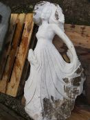 A large white marble type statue of a dancing lady (damaged arm) H 130 cm, W 70 cm