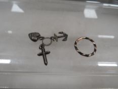 An antique Faith,Hope and Charity charm together with a gold mounted ring marked 9ct