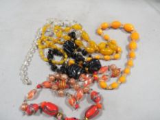 Five strings of vintage glass beads