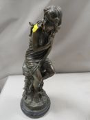 A bronze effect of a semi-nude female