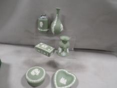 A tray of green Wedgwood Jasper ware to include rare table lighter, tobacco jar etc