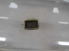 A 19th century mourning brooch set with woven hair