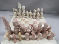 A soap stone hand carved chess set and board