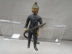 An unusual lead style bobble headed figure of a fireman