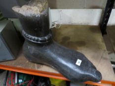 A large black stone type statue of a foot - L 50 cm, H 40 cm