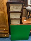 A modern wicker shelving unit together with a folding card table and a packing trunk (3)