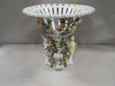 A modern reproduction cherubic table ceramic centerpiece