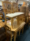 A modern kitchen table and four chairs