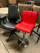 A modern red swivel barstool together with an office armchair