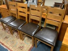 A set of four modern oak dining chairs