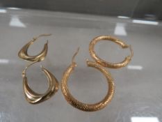 Two pairs of 9 carat gold hoop earrings approx. weight 1.8g
