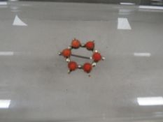 An antique 19th century brooch set with Coral