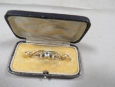 A Victorian Aquamarine and seed pearl brooch marked 9ct in original box
