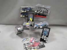 A tray of Formula 1 collectable toys