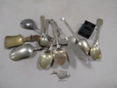 A small box of spoons to include two hallmarked silver examples