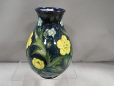 A Moorcroft floral vase marked with a silver line