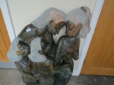 A stone type statue of four females, H 107 cm, W 70 cm