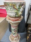 A ceramic jardinière decorated with classical figures