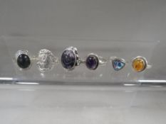 Six vintage ladies silver dress rings, including amber and blue john set examples